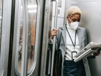 Woman in mask on a subway