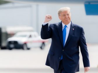 President Donald J. Trump gestures with a fist pump as he walks across the tarmac upon his arrival Thursday, Oct. 15, 2020, to Pitt-Greenville Airport in Greenville, S.C. (Official White House Photo by Shealah Craighead)