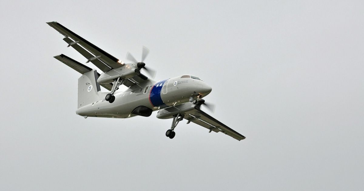 The CBP Dash 8 comes in for a landing after being part of the “air showcase” at EAA AirVenture 2011.