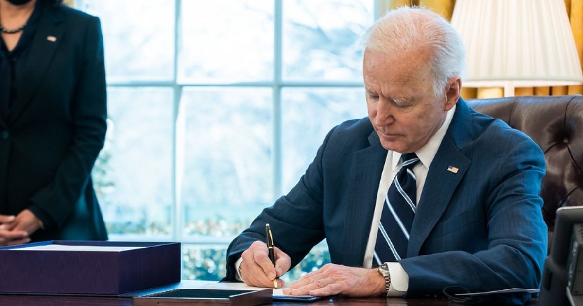 President Joe Biden, joined by Vice President Kamala Harris, signs H.R. 1319, the “American Rescue Plan Act of 2021” Thursday, March 11, 2021, in the Oval Office of the White House. (Official White House Photo by Adam Schultz)