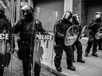 Policemen holding fiber glass shields in Washington D.C.