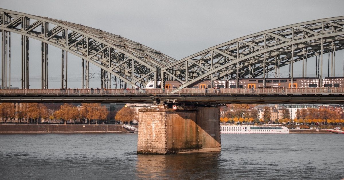 Bridge over a river with a train running across.