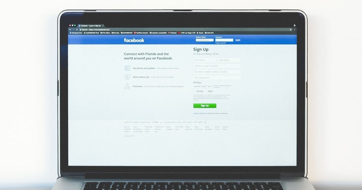 Facebook login page on a laptop screen