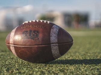 Wilson football sitting on a field