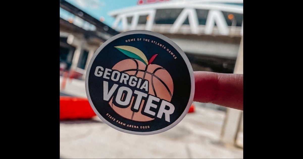 A Georgia voting sticker is pictured outside the State Farm Arena in Fulton County, Georgia.