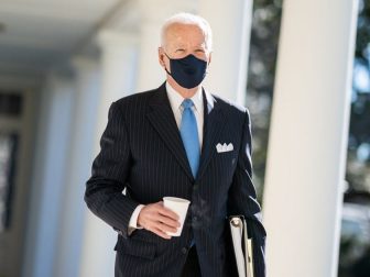 President Joe Biden walks with a cup of coffee Tuesday, March 2, 2021, along the Colonnade of the White House to the Oval Office. (Official White House Photo by Adam Schultz)