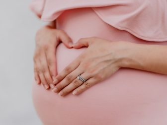 Pregnant woman in a pink dress