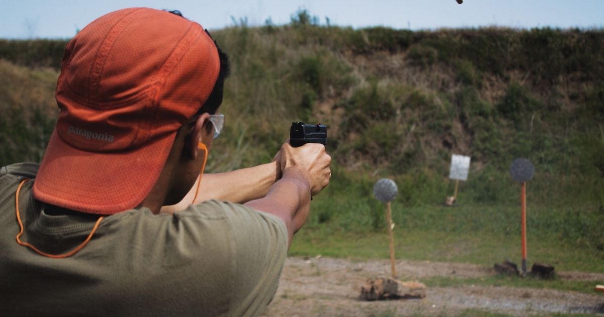 Man practicing at a shooting range