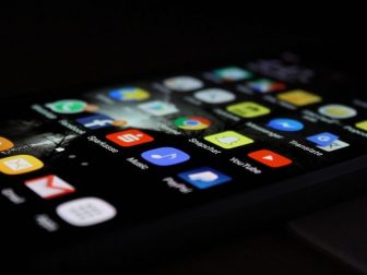 Phone in the dark displaying social media apps