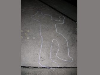 Shell casings next to chalk outline