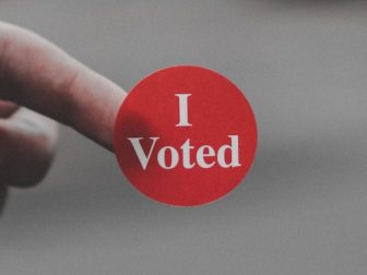 Red 'I Voted" sticker