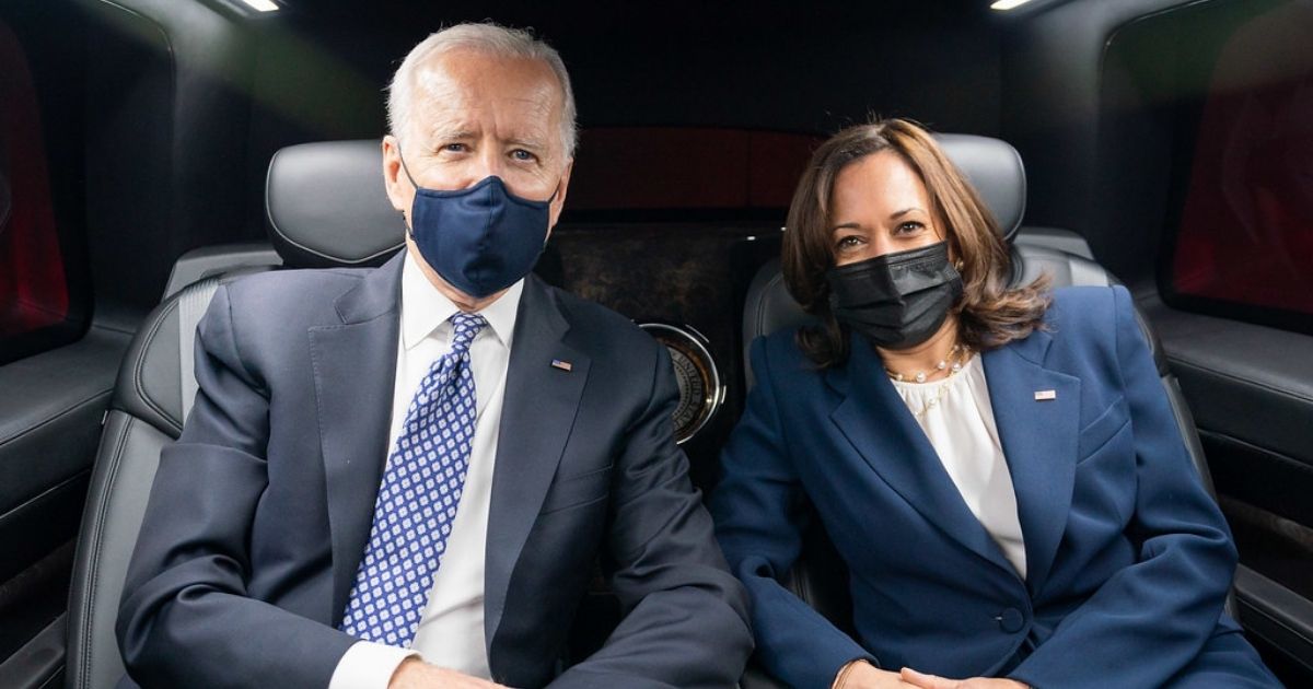 President Joe Biden and Vice President Kamala Harris pose for a photo as they ride in the Presidential limousine from Emory University in Atlanta Friday, March 19, 2021, to Peachtree Dekalb Airport. (Official White House Photo by Adam Schultz)