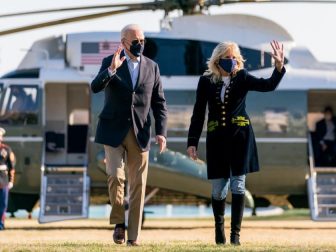 President Joe Biden and First Lady Jill Biden wave as they walk across the South Lawn of the White House after disembarking Marine One Sunday, March 21, 2021, concluding their trip to Camp David in Thurmont, Maryland. (Official White House Photo by Cameron Smith)