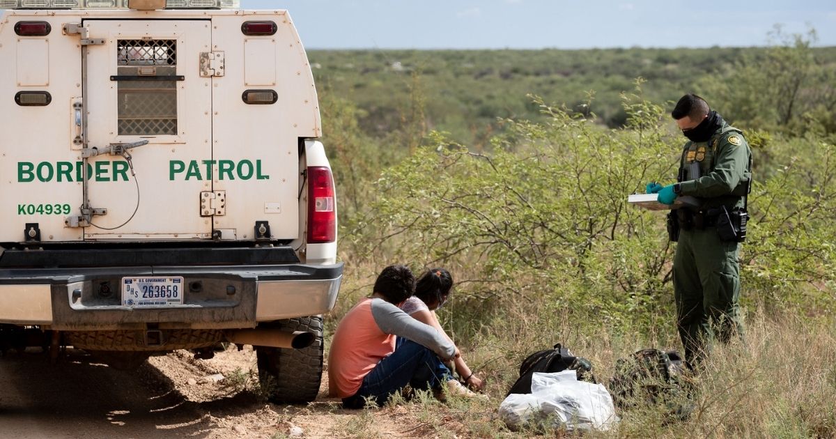 U.S. Customs and Border Protection operations following the implementation of Title 42 USC 265 at the northern and southern land borders. A U.S. Border Patrol agent uses personal protective equipment as he prepares to transport two individuals encountered near Naco, Ariz. on August 12, 2020. (CBP Photo by Jerry Glaser)