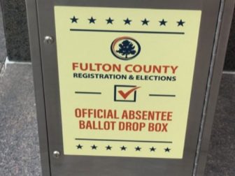 The above photo shows a Fulton County official absentee ballot drop box.