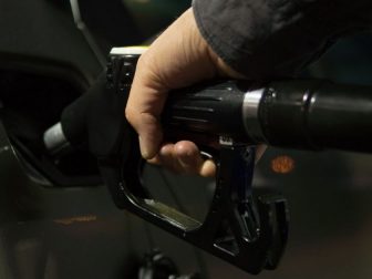 Hand holding a gas pump