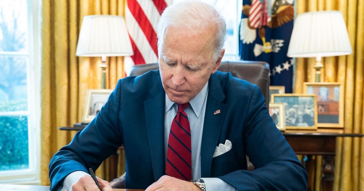 President Joe Biden signs a bill, S. 579, the ALS Disability Insurance Access Act of 2019 which retroactively gives access to Social Security disability benefits for individuals with ALS Tuesday, March 23, 2021, in the Oval Office of the White House. (Official White House Photo by Adam Schultz)