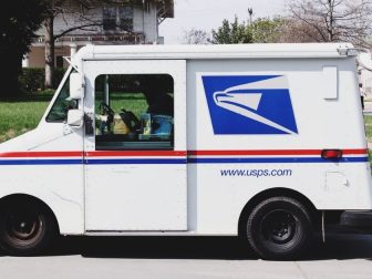 USPS delivery truck outside a home