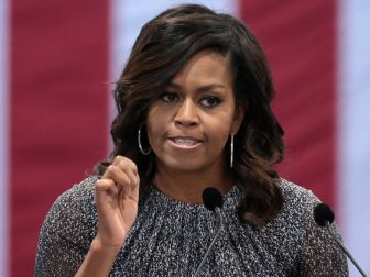 First Lady of the United States Michelle Obama speaking with supporters of former Secretary of State Hillary Clinton at a campaign rally at the Phoenix Convention Center in Phoenix, Arizona.