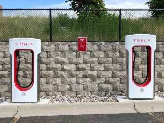 Tesla car charging stations in a parking lot