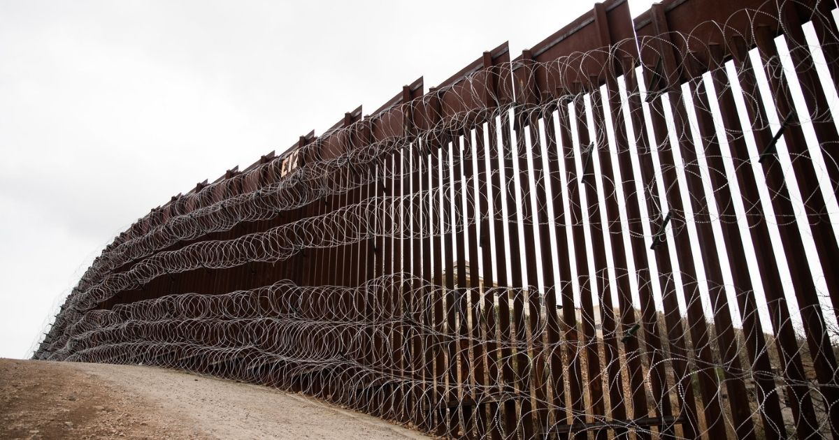 Layers of Concertina are added to existing barrier infrastructure along the U.S. - Mexico border near Nogales, AZ, February 4, 2019. Photo: Robert Bushell