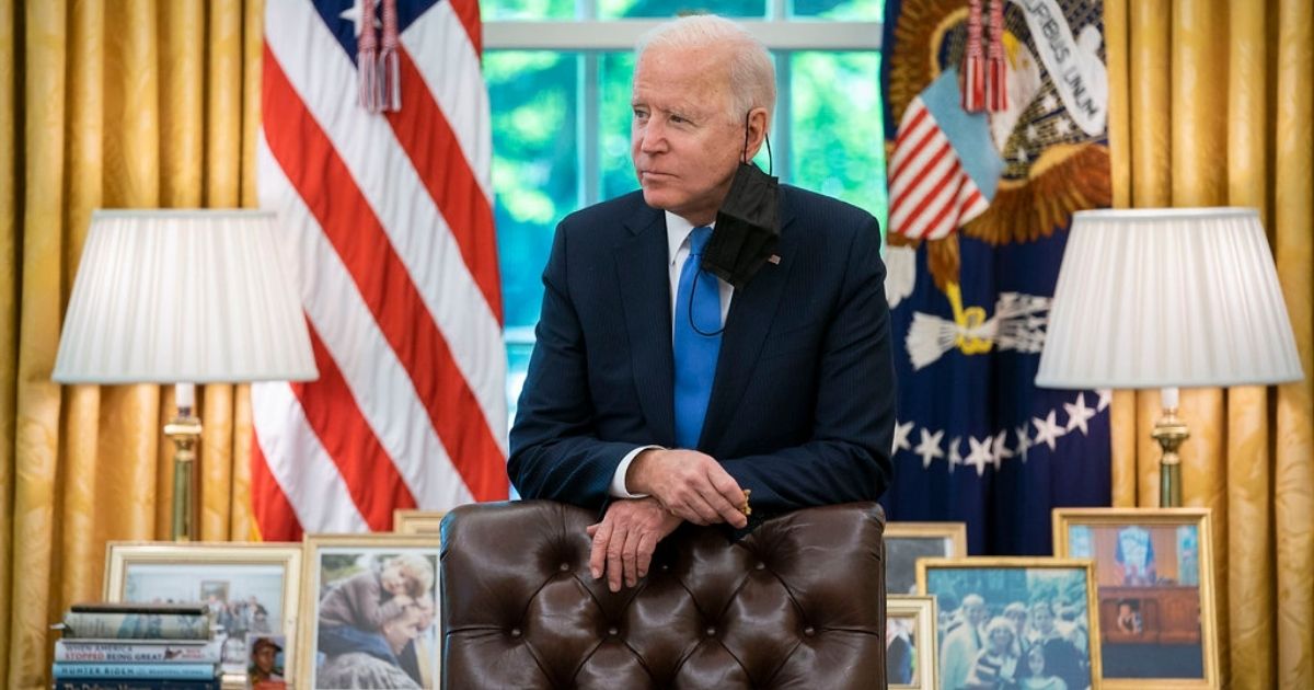 President Joe Biden prepares remarks regarding the Colonial Pipeline cyberattack and resumption of operations, Thursday, May 13, 2021, in the Oval Office of the White House.