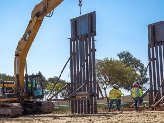 Construction workers putting up new wall at the border located at the Chula Vista Area of Responsibility, California, on June 19, 2018. Seen here is the placement of a new border wall panel. Photo by: Tim Tucciarone