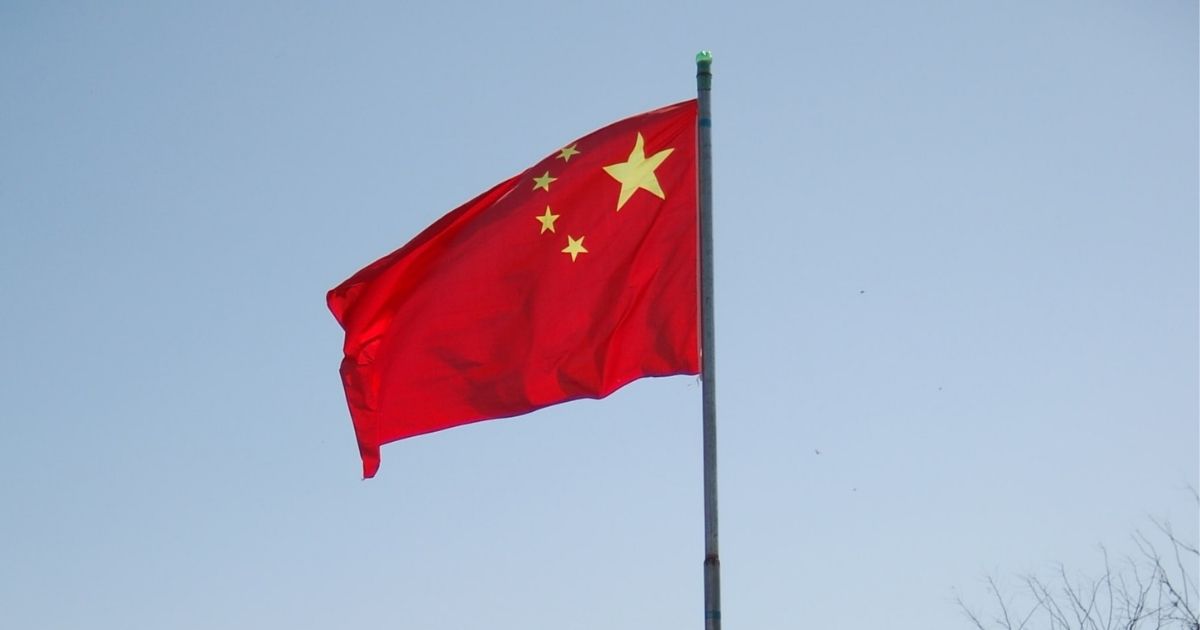 Chinese flag flying on a flag pole