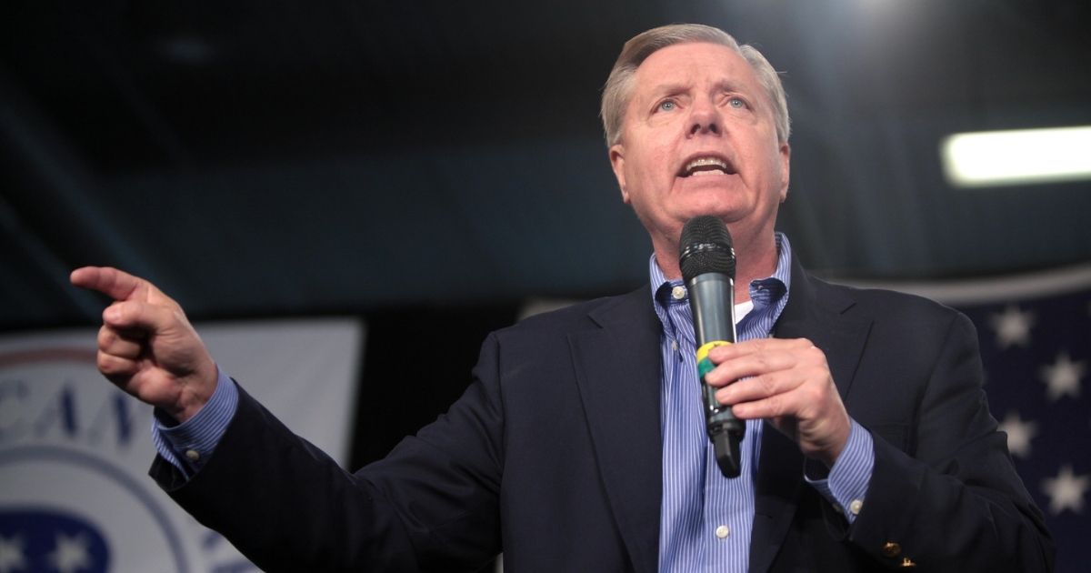 U.S. Senator Lindsey Graham speaking with attendees at the 2015 Iowa Growth & Opportunity Party at the Varied Industries Building at the Iowa State Fairgrounds in Des Moines, Iowa.