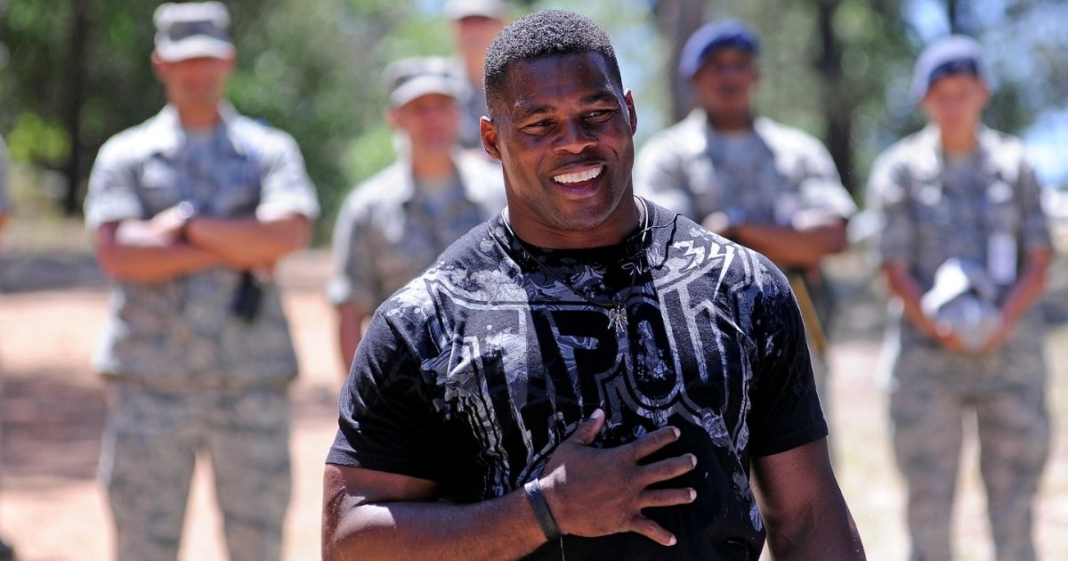 Football great Herschel Walker speaks to the Class of 2016 during Basic Cadet Training in the U.S. Air Force Academy's Jacks Valley in Colorado Springs, Colo. July 17, 2012. Walker spent time talking to the Class of 2016 about resiliency, his own personal struggles in life and encouraged the cadets to reach out and seek help if they need it.