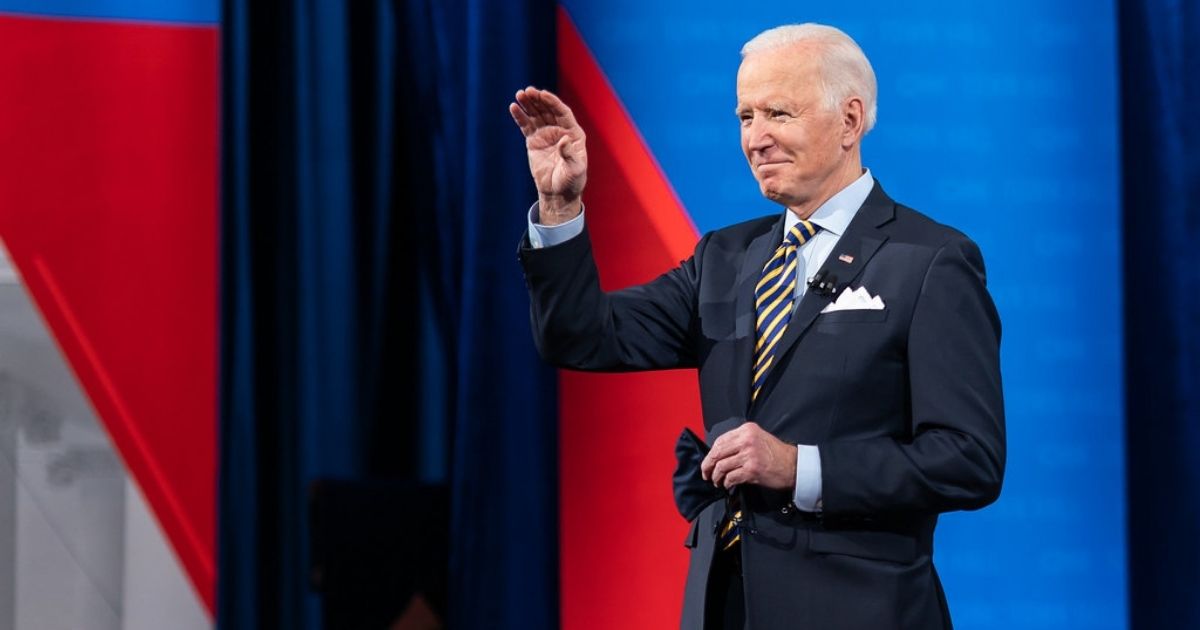 President Joe Biden waves to the guests during a CNN Town Hall with Anderson Cooper Monday, Feb. 16, 2021, at the Pabst Theater in Milwaukee, Wisconsin.
