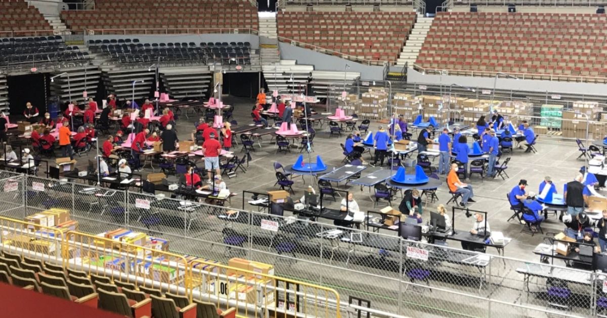 Auditors examine ballots in the Maricopa County, Arizona, full forensic election audit on Tuesday in the Veterans Memorial Coliseum in Phoenix.