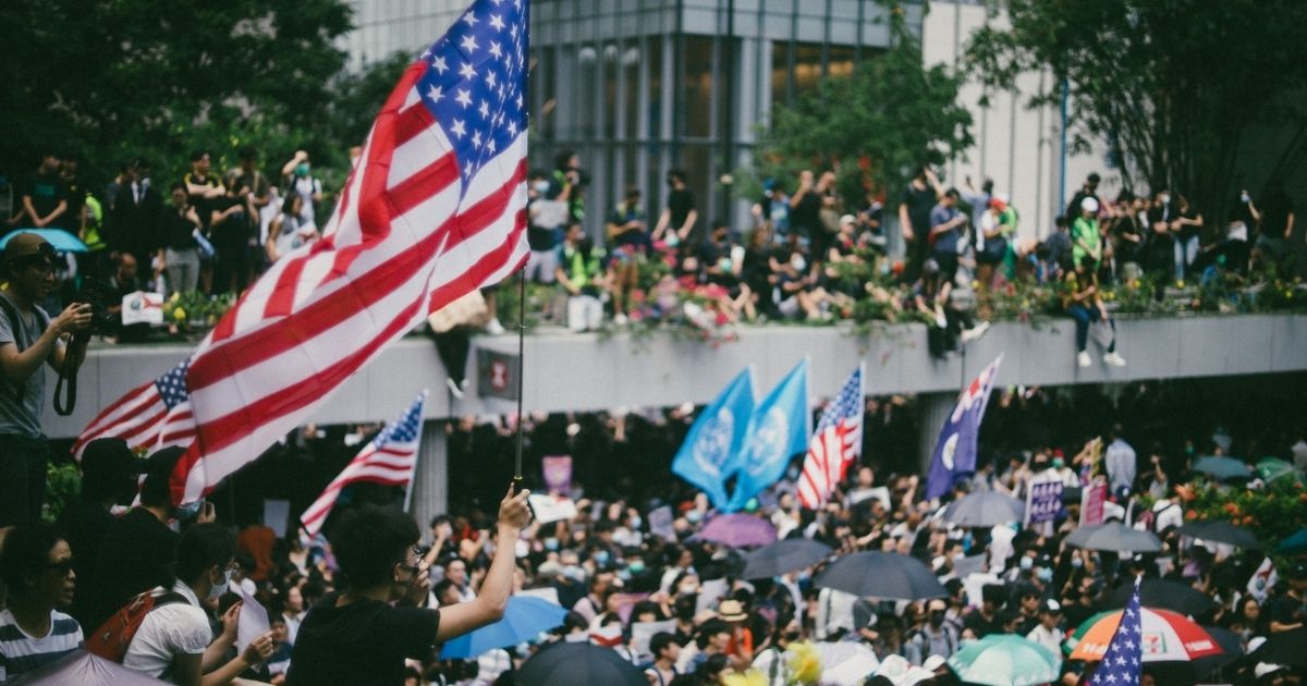 Tens of thousands of protesters waving US flags marched on Hong Kong's US Consulate