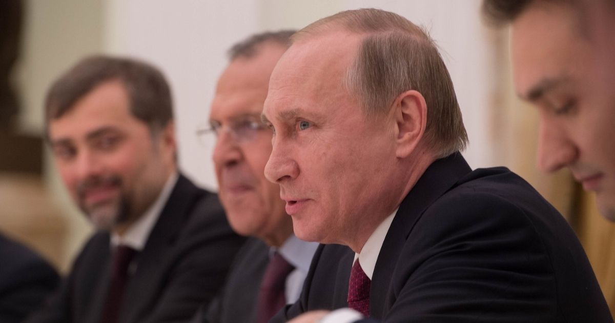 Russian President Vladimir Putin, accompanied by Russian Foreign Minister Sergey Lavrov, second from right, speaks during a meeting focused on Syria and Ukraine with U.S. Secretary of State John Kerry at the Kremlin in Moscow, Russia, on March 24, 2016.