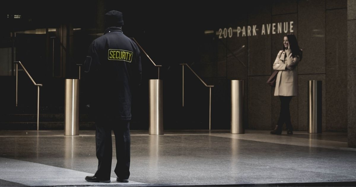 Security guard on a city sidewalk