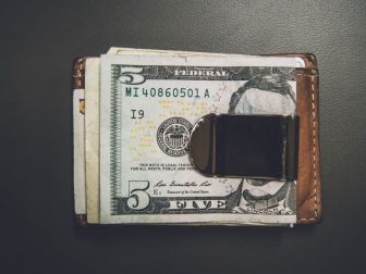 Wallet with cash clipped on to the outside