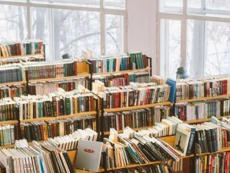 Library with book shelves of colorful books