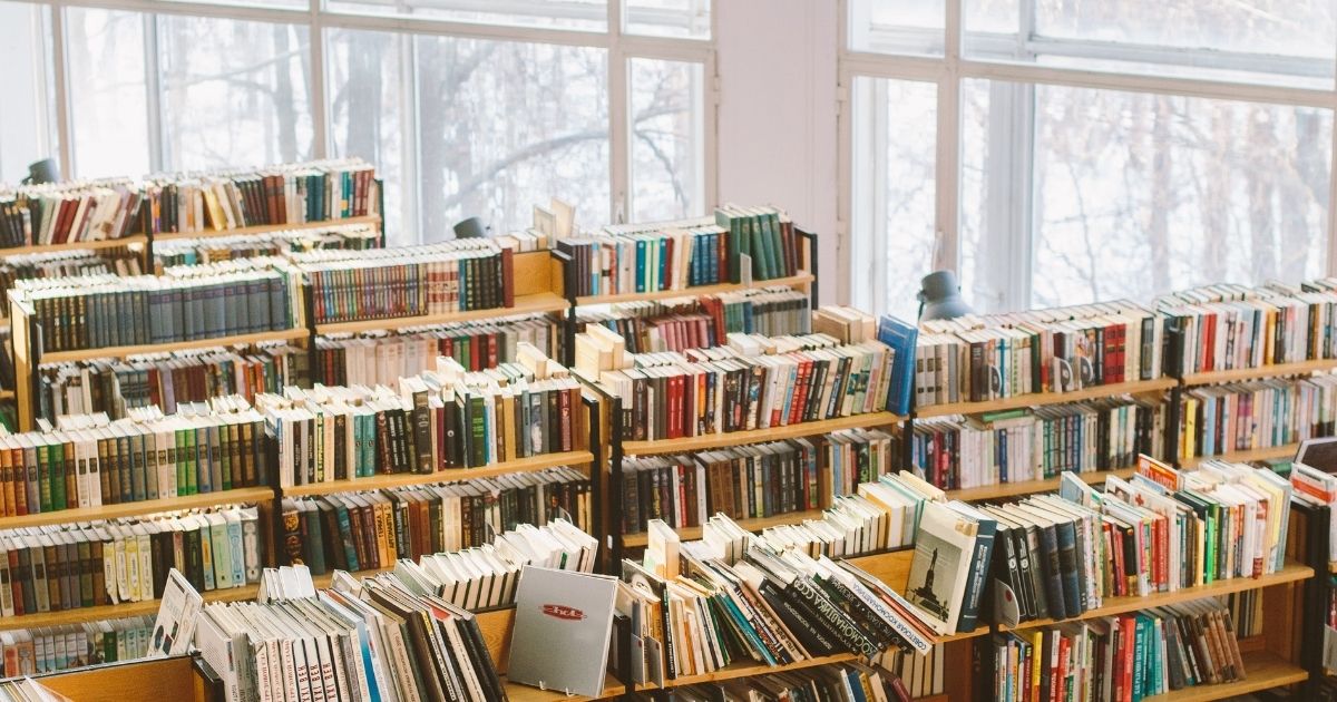 Library with book shelves of colorful books