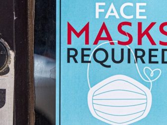 Sign reading "face masks required" at a Chicago, IL store