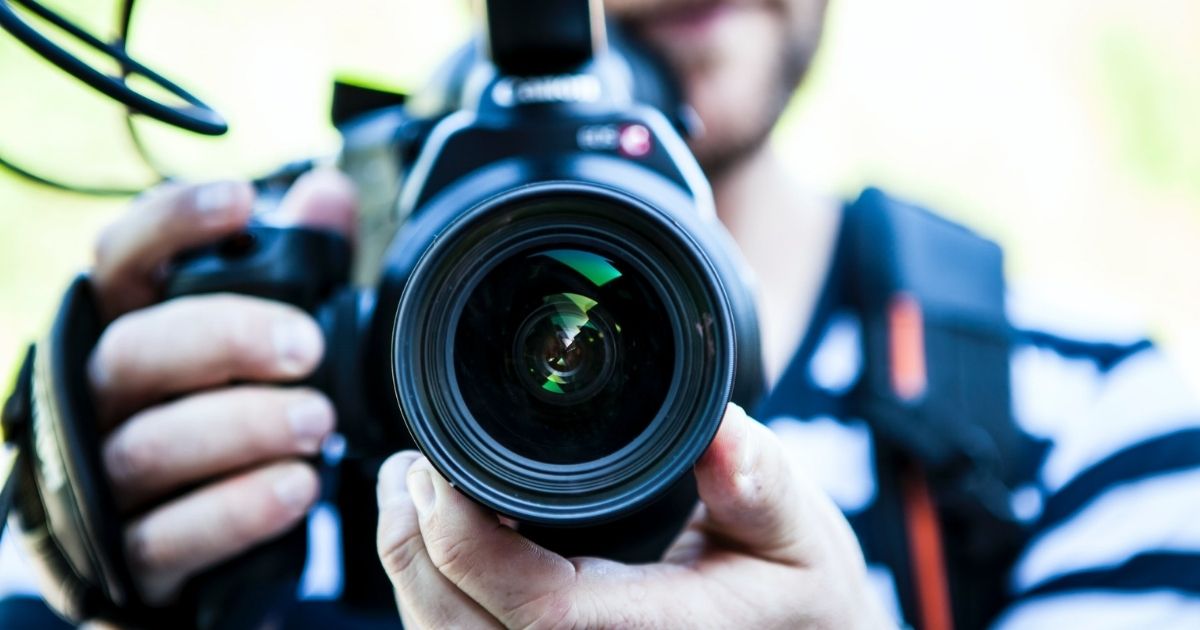 Person holding a camera