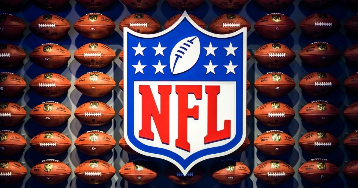 NFL logo with footballs in the background