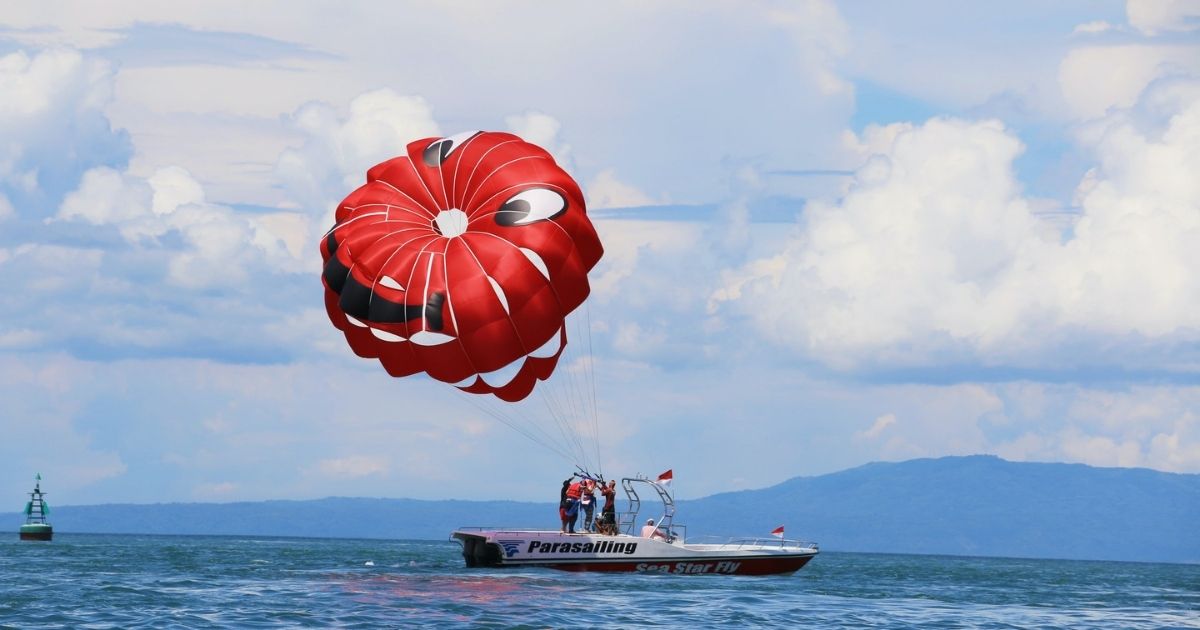 Red parasailor on a boat