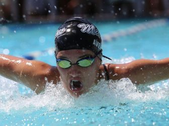 Swimmer with swim cap and goggles