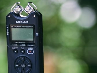 Tascam recording device with green background