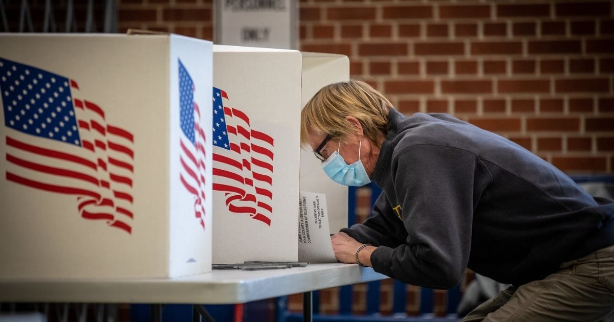 Voters in Des Moines precincts 43, 61 and 62 cast their ballots at Roosevelt High School.