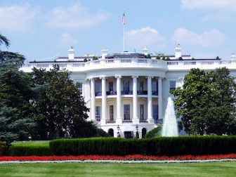 White House with red flowers in front