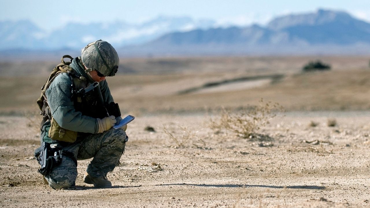 U.S. Air Force Tech. Sgt. Stacia Zachary, a U.S. Air Forces Central Combat Camera combat correspondent, takes notes as she covers Joint Terminal Air Control Airmen from the 807th Air Support Operations Squadron, Forward Operating Base Lagman as they make sure a dirt landing zone in the Zabul province of Afghanistan was safe for a C-130 Hercules to land while providing the aircrew with any pertinent information via radio communications.