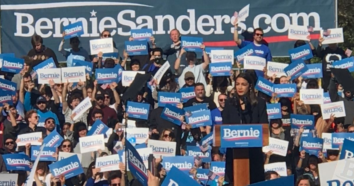 Thousands attend a #BerniesBack rally in New York, where Democratic Rep. Alexandria Ocasio-Cortez, center, is officially endorsing Vermont Sen. Bernie Sanders for president.