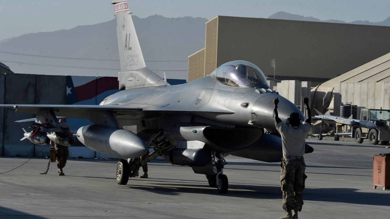 An Airman taxis a F-16 Fighting Falcon with the 100th Expeditionary Fighter Squadron “Red Tails” at Bagram Airfield, Afghanistan Aug. 7, 2014. The mission of the F-16 Fighting Falcon here is to provide tactical air-to-air and air-to-ground support for Operation Enduring Freedom. The unit is deployed from the 187th Fighter Wing in Montgomery, Ala. (U.S. Air Force photo by Staff Sgt. Evelyn Chavez/Released)