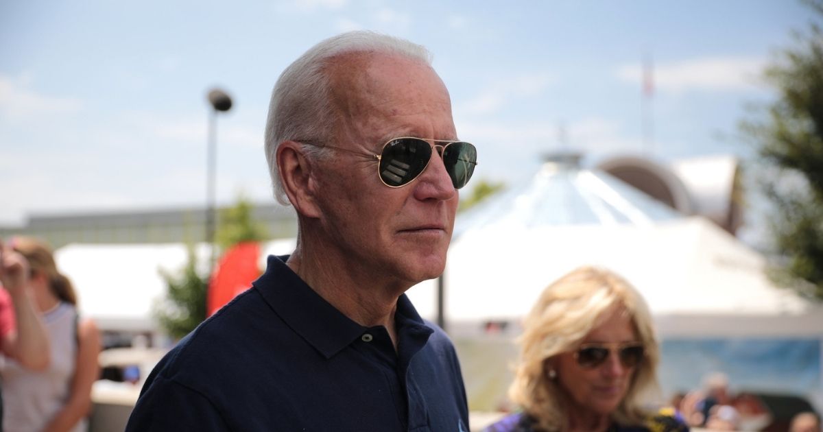 Former Vice President of the United States Joe Biden and former Second Lady of the United States Jill Biden speaking with supporters at the Des Moines Register's Political Soapbox at the 2019 Iowa State Fair in Des Moines, Iowa.